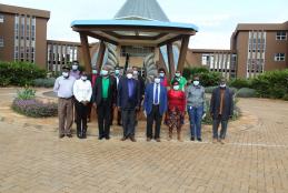 Officers from the Kenya Forestry Research Institute (KEFRI), the Kenya Forest Service (KFS) led by Dr. Joram Kagombe and WMI staff led by Prof. David Mungai, Director WMI, pose for a photograph at the Wangari Maathai Fountain of Peace after a first joint meeting to plan for the establishment of a multi-functional tree nursery at the Wangari Maathai Institute (12th February, 2021)