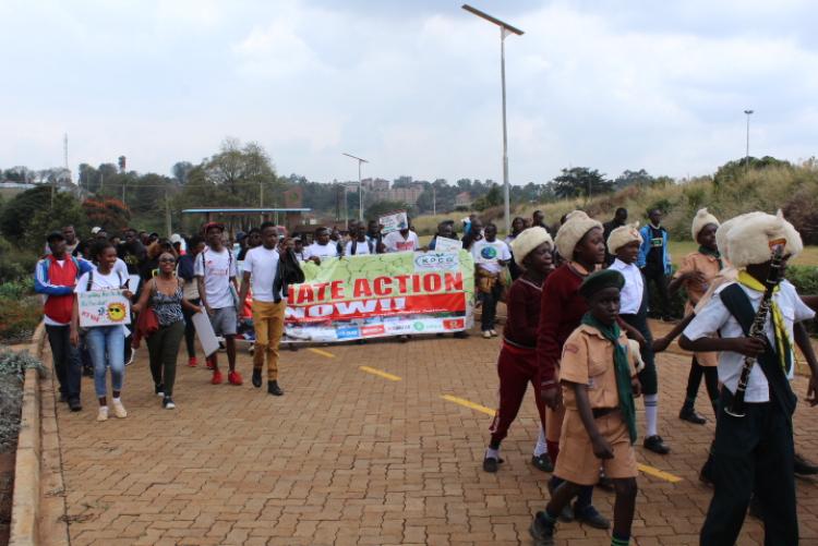 Climate change action enthusiasts march to the Wangari Maathai Institute during the climate change walk on September 27, 2019