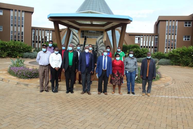 Officers from the Kenya Forestry Research Institute (KEFRI), the Kenya Forest Service (KFS) led by Dr. Joram Kagombe and WMI staff led by Prof. David Mungai, Director WMI, pose for a photograph at the Wangari Maathai Fountain of Peace after a first joint meeting to plan for the establishment of a multi-functional tree nursery at the Wangari Maathai Institute (12th February, 2021)